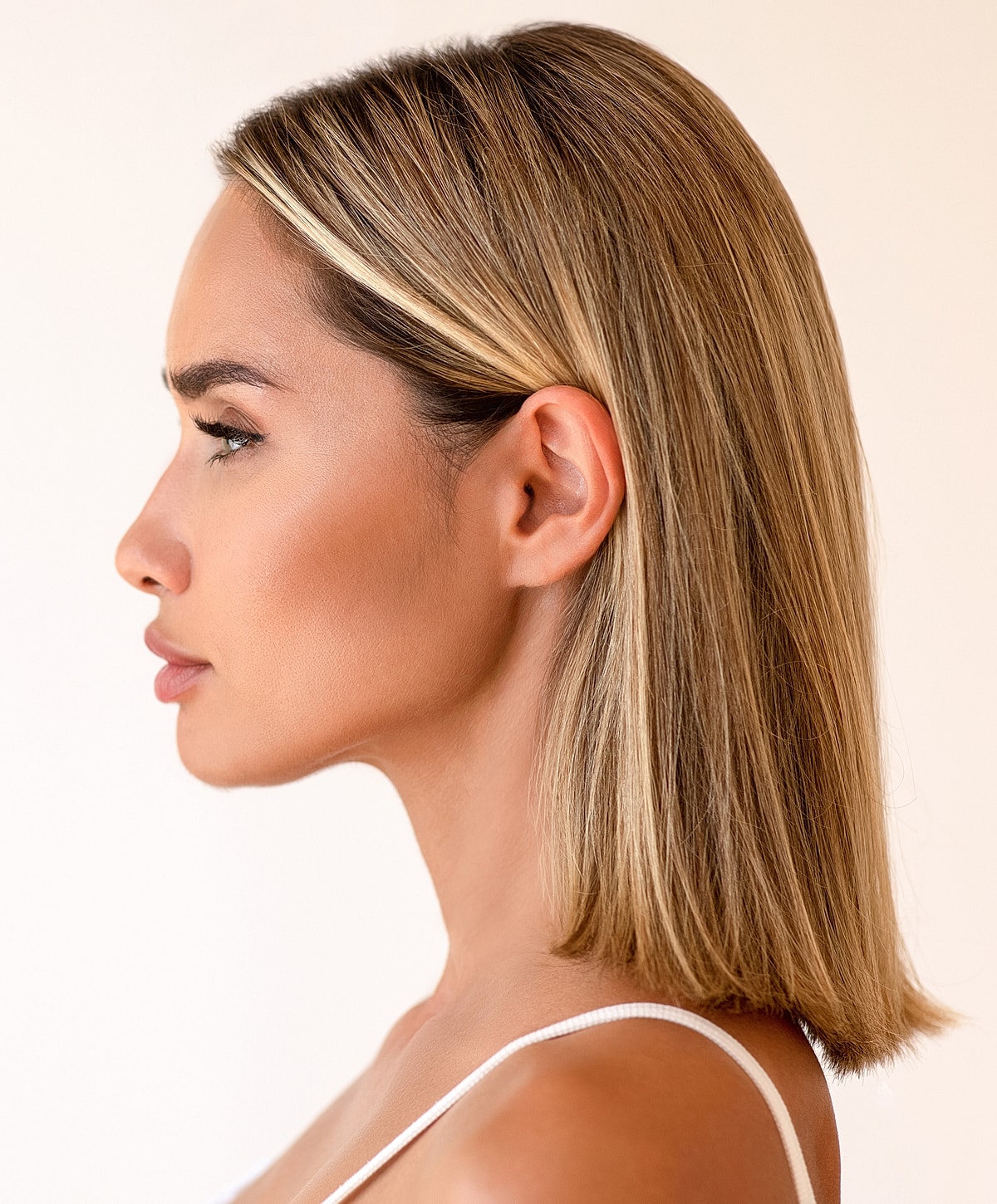 Profile view of a woman with blonde hair.